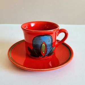 Hand painted vibrant colors tea coffee cup with saucer.